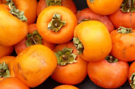 How To Eat A Persimmon 4 Easy Steps To Enjoy This Unique Fruit Insteading Growing Vegetables Persimmon Fruit Growing Tomatoes