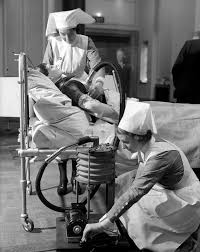Nurses Practice Operating A Respiratory Jacket That Performs A Similar Function To An Iron Lung Circa 1938 Medical Photos Medical Antiques Vintage Medical