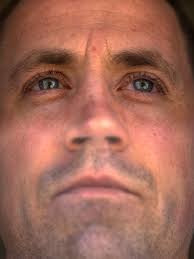 Did officers ram prisoner's head into window, or did he crack it himself?