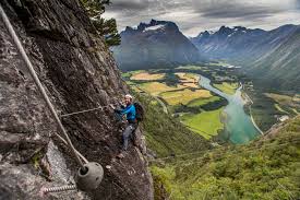 Via ferrata is an italian term that mean's iron road, or path (in germany and austria it's called klettersteig). Romsdalstigen Via Ferrata Andalsnes Norway Fjord Tours