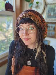 My newest design....I call her "Stained Glass" slouch hat....with a pom and  without...I think I love her 💜💙💜***