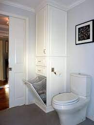 Laundry baskets don't have to be made of canvas or wicker cane. Hidden Hamper Or Perhaps Laundry Chute Laundry In Bathroom Bathroom Linen Tower Small Bathroom Remodel