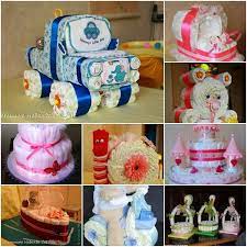 The actual cake is constructed with diapers and then it's accessorized with cute baby things. Diaper Packaging Ideas Diaper Gifts Baby Shower Diaper Cake Baby Shower