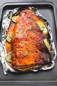 Sweet And Spicy Baked Honey Sriracha Lime Salmon In Foil Is Tender And Flaky And Has The Most Incredible Fla Baked Salmon Recipes Salmon Dishes Salmon Recipes