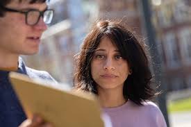 Taking a closer look under Alumni Walk. Early in May, students in Assistant  Professor of Earth and Climate Sciences Shreya Arora's Short Term class  searched for an underground passage between Lane and