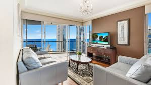 Tall living room with red chevron pillows. Chevron Renaissance Level 40 Ocean River Views Holiday Holiday