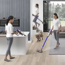 Woman Vacuuming In Different Places Around A Home Cordless Vacuum Dyson Cordless Vacuum Vacuum Cleaner