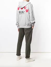 We recommend ordering at least one size up from your usual size and checking the below size guide. Comme Des Garcons Play Zipped Hoodie In Grey Cotton With Hearts On The Back