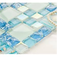 Glass mosaic tiles, 300x300mm glass mosaic tiles which can be see through so it gets the name as crystal, but with the color paints on the back of the mosaic tiles makes. Cracked Blue Glass Mosaic Mediterranean Style Resin With Conch Shell Beach Inspired Backsplash Iridescent White Tile