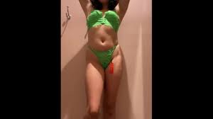 Teen trying on lingerie in mall dressing room