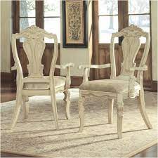Find out more about the ortanique dining room chair | ashley furniture homestore here. D707 01a Ashley Furniture Ortanique Dining Upholstered Arm Chair