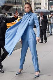 Gigi hadid vs dua lipa — who wears this wild, colorful versace bodysuit better? Gigi Hadid Proves She S A Street Style Superhero In Caped Emilia Wickstead Jumpsuit