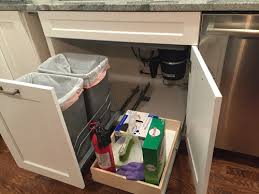 We are working on cabinet layout for a major kitchen renovation and we'd like to put trash and recycling pull outs in a bank of 18 deep cabinets (can't do 24 in this area, but it's the place we really want to put the trash). Trash Pullout And Drawer Under Sink Finally Installed