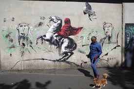 Steve lazarides has revealed candid snaps from his 11 years working with the anonymous artist. Street Artist Banksy Splashes Paris With Works On Migrants Chicago Sun Times