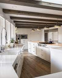 Choosing lighter tones of wood here is the norm, but nothing stops you from going down a darker there were times when ceilings beams were an absolute must in every home as they provided. Lovely Rustic Wood Accents In Modern White Kitchen Kitchen Ceiling White Modern Kitchen Kitchen Design