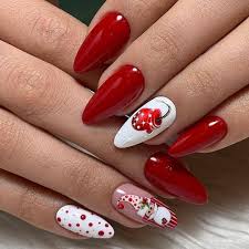 Each nail in this manicure is different, but it all plays together beautifully. Winter Nail Art Red And White Design Nail Art Designs