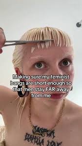 Liberal woman cuts her bangs EXTRA short, so men don't approach her...