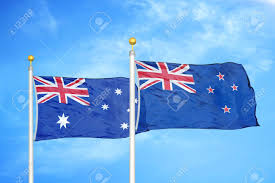 Australian vs new zealand flag difference between the flags. Australia And New Zealand Two Flags On Flagpoles And Blue Cloudy Stock Photo Picture And Royalty Free Image Image 143779594