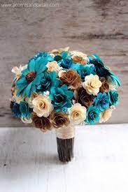 The loose unstructured look of this all white wedding bouquet is perfect for a casual rustic outdoor wedding. Brown Copper Teal And Ivory Bouquet Made Of Wood Flowers Paper Flowers Wedding Flower Bouquet Wedding Bridal Bouquet