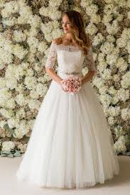 Find the perfect wedding dress for your special day at a wed2b. Bardot Lace Top Wedding Dress Joyce Young