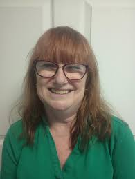 Could someone help improve this photo for a sales position company photo?  We usually use a white background.