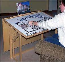 Folding Puzzle Table Cover Keeps Helpers At Bay The Dog Will Never Eat Another Puzzle Piece Puzzle Storage Puzzle Table Woodworking Jigsaw