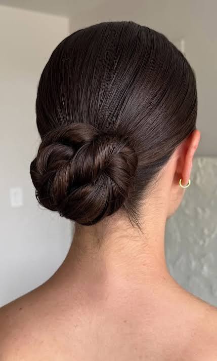 Low Bun Updos : Modern Deep Brunette Twisted Low Chignon Wedding Hairstyle