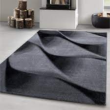 Beau tapis épais gris blurr light de style contemporain, fait d'un grand rectangle gris clair, parsemés ça et la de pointillés noirs, qui forment parfois des lignes. Tapis De Salon Moderne Design Abstrait Vagues Modele Noir Gris Oeko Tex 200x290 Cm Cdiscount Maison