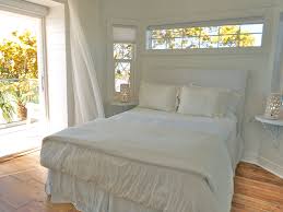 Pin By Leah Anderson On Beach House Master Bedroom Windows Window Above Bed Bedding Master Bedroom