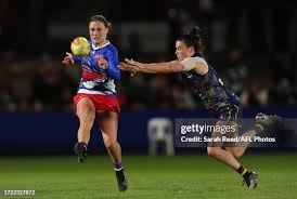 Maggie Gorham of the Bulldogs and Eloise Jones of the Crows during... News  Photo
