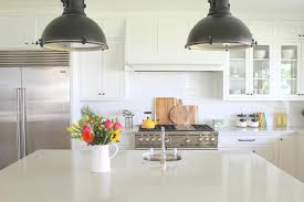 Oil Rubbed Bronze Industrial Lights Over White Quartz Island Transitional Kitchen
