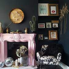 Victorian living room with a touch of modern style boasts contemporary wall art pieces mounted on the sides of a marble fireplace topped with a mirror. Modern Victorian Design Walls Of Wonderland