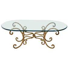 Wrought iron or wood base. Twisted Wrought Iron Rope Gold Gilt Base Oval Racetrack Glass Top Coffee Table For Sale At 1stdibs