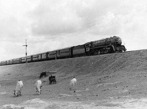Udyaan Abha Toofan Express showing its full glory from steam era. Pacific class WP, departure Agra 1975 (WS)
