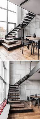 This Staircase That Leads Up To The Mezzanine Level Is Made From Black Steel And Wood Stair Treads Stairs Design Modern Interior Stairs Modern Stairs