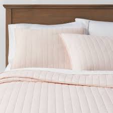 The most recent twin quilt is in pale grey; Linen Quilts Target