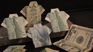 Take each corner at the top and fold them down and towards the middle to make a triangle. How To Make A Dollar Bill Shirt Youtube