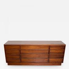 Features figural walnut grain, carved pulls and tapered legs. John Keal John Keal Walnut Dresser For Brown Saltman Mid Century Danish Modern 1960s Usa