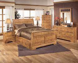 Bittersweet Sleigh Queen Bedroom Set With Underbed Storage In Pine Grain Queen Bedroom Sets Bedroom Sets Ashley Bedroom Furniture Sets Cheap Bedroom Furniture Bedroom Furniture Sets