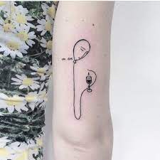 Minimalist Style Balloon And Vine Glass Tattoo On The Back Of The Right Upper Arm Glass Tattoo Tattoos Minimal Tattoo