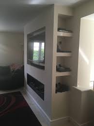 How To Store All The Boxes Associated With Your Tv Hidden Shelves Hidden Power Outlets Living Room Decor Fireplace Feature Wall Living Room Fireplace Tv Wall