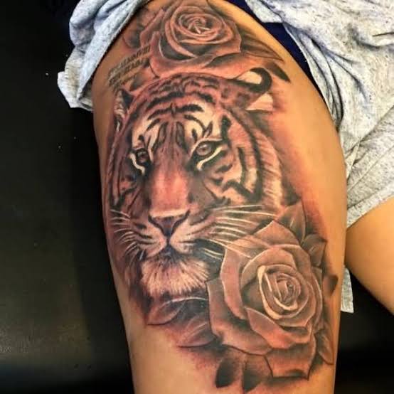 Grey Rose Flower and Tiger Head Tattoo on Thigh | Tiger tattoo for women thighs, Tiger and rose tattoo for women, Tiger tattoo leg