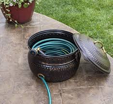 Some of the links in this article are affiliate links. Birdrock Home Decorative Water Hose Holder With Lid Distressed Bronze Ground Garden Hose Pot Handle Embossed Steel Metal With Copper Accents Outdoor Or Indoor Use Buy Online