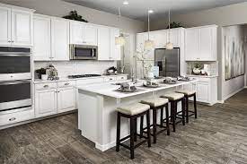 Keep your kitchen cabinets up to date with a modern makeover. White Kitchens Always In Style Allman Model Home Mesa Arizona Richmond American Homes Hardwood Floors In Kitchen Kitchen Flooring Wood Floor Kitchen