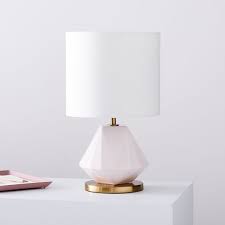 From tall and stout lamp bases to thin and thick ones, you'll not only love having a bright room to walk into, but also the way the lamp complements the rest of your home decor. Faceted Porcelain Table Lamp Small
