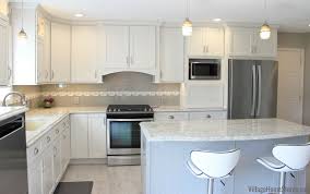 Kitchen Remodel In Alpha Il With Linen White And Zinc Painted Dura Supreme Cabinetry And Cambria Quartz Hidden Laundry Laundry In Kitchen Kitchen Room Design