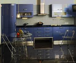 A Modern Blue Kitchen With Glossy Cabinets Kitchen Design Blue Kitchen Cabinets Custom Kitchen Cabinets