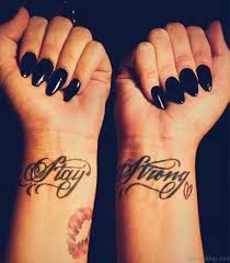 A tattoo that wraps around like a bracelet. 50 Charming Wording Tattoos For Wrist