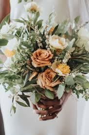We provide fresh flowers from the farm to your doorstep. Bridal Bouquet By Designs By Ahn Cream Yellow Light Orange Spring Bride Wedding In Yellow Wedding Flowers Orange Wedding Flowers Yellow Wedding Bouquet