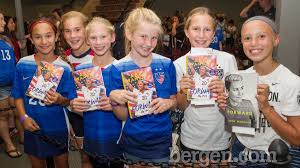 Fans greet Olympic gold medalist Abby Wambach in Ridgewood